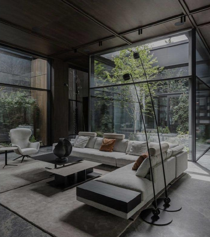Contemporary living room with real furniture, overlooking a garden